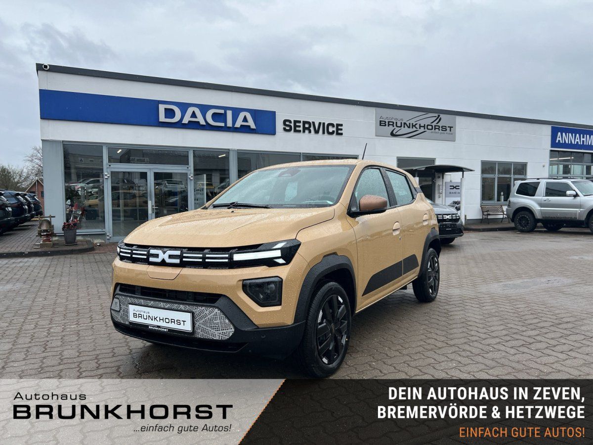 Dacia Spring Elektro in Sandfarbe im Autohaus Brunkhorst Showroom