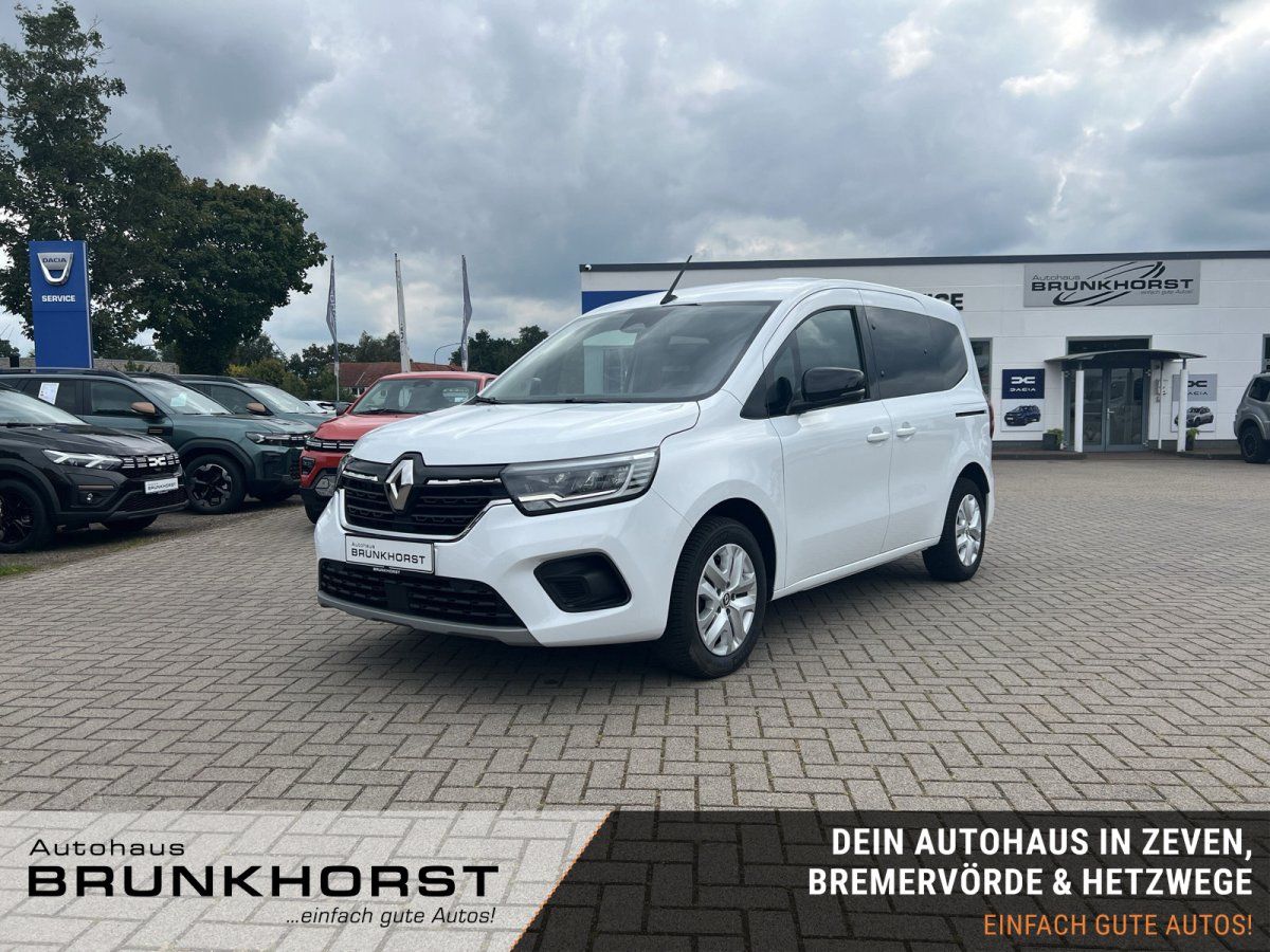 Renault Kangoo in Weiß im Autohaus Showroom – Frontansicht schräg