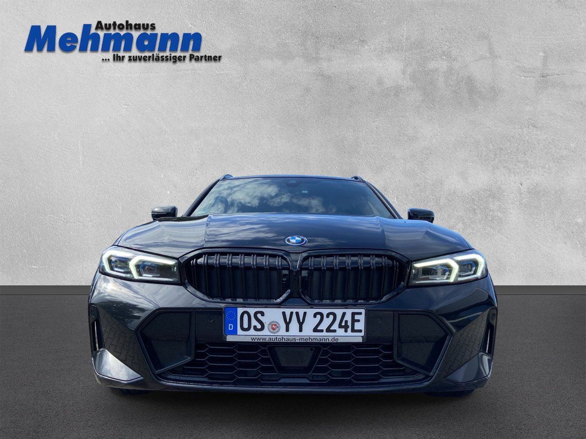 BMW 3er Touring schwarz, Frontansicht mit LED-Scheinwerfern und Kühlergrill
