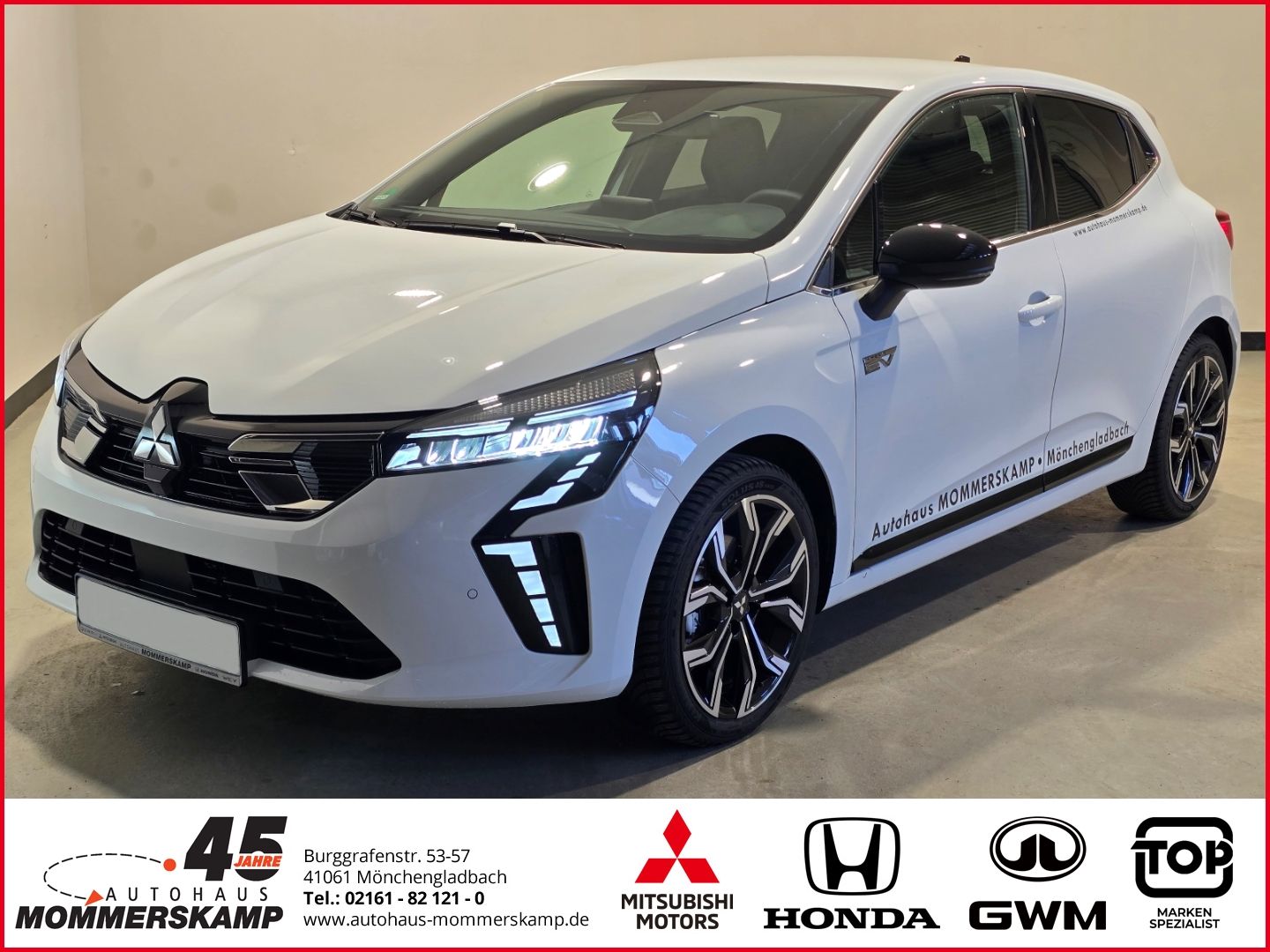 Mitsubishi Colt weiß Seitenansicht schräg vorne mit Alufelgen
