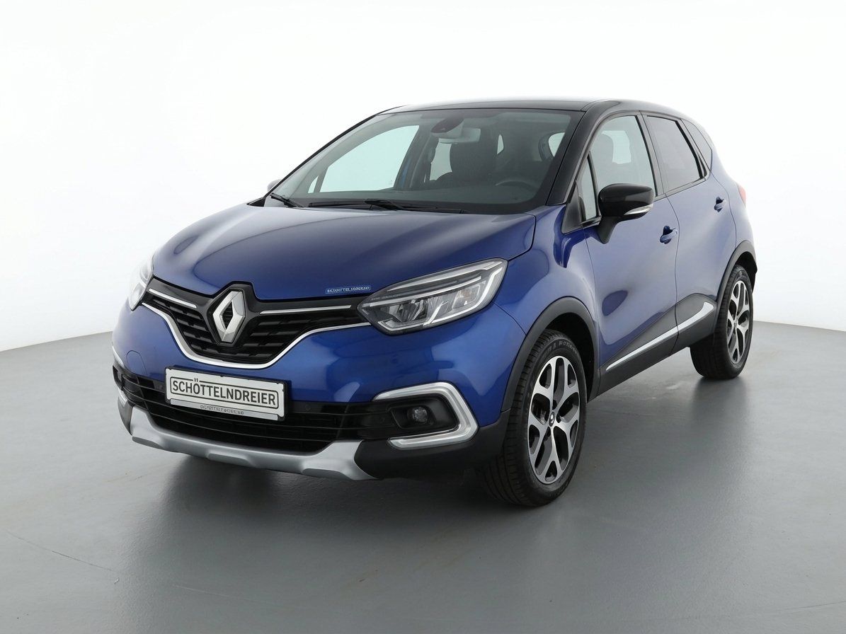 Renault Captur in Blau, Frontansicht beim Händler Schöttelndreier