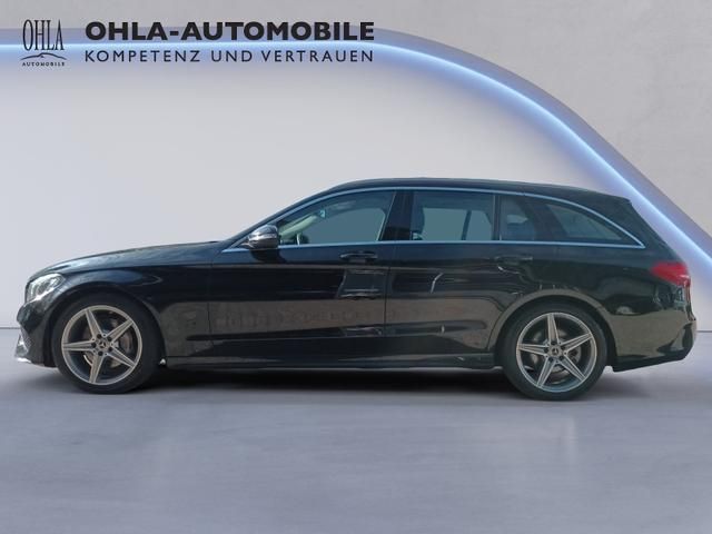 Mercedes-Benz C-Klasse T-Modell schwarz mit AMG-Felgen Seitenansicht