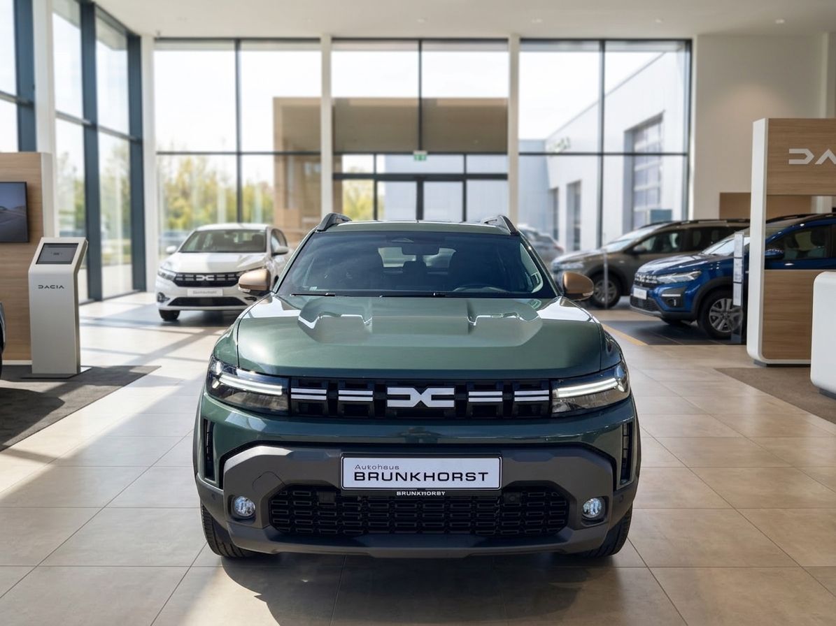 Dacia Kompakt-SUV Frontansicht in grün-blau metallic bei Autohaus Brunkhorst