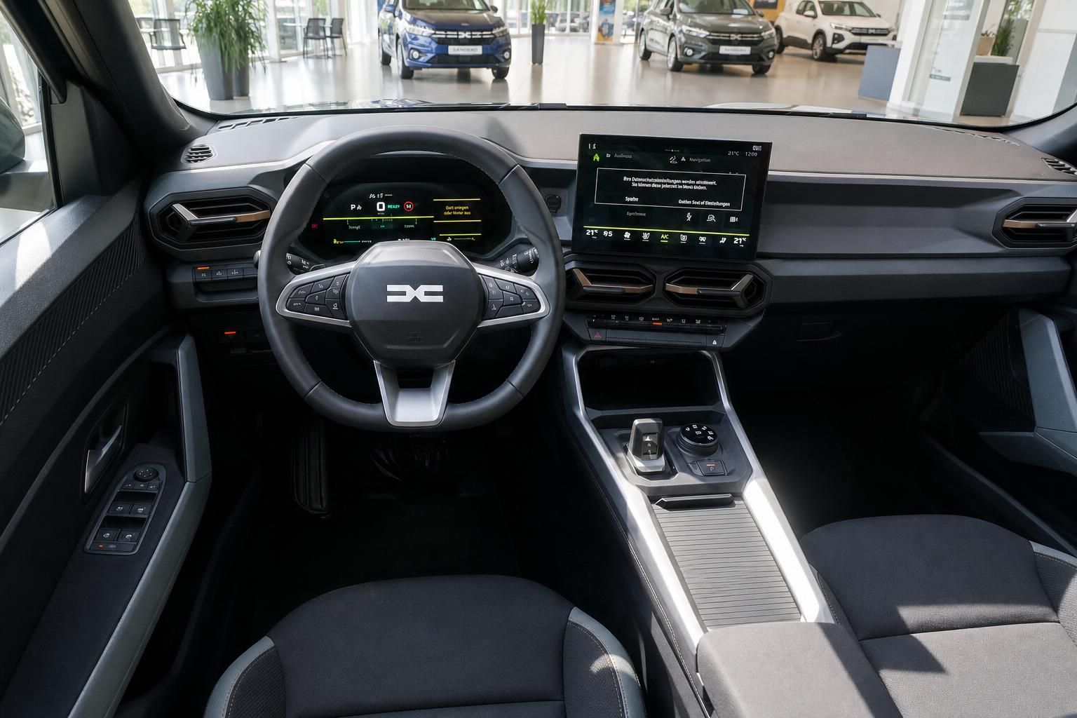 Cockpit mit Lenkrad, Digitalinstrumenten und Touchscreen-Infotainmentsystem