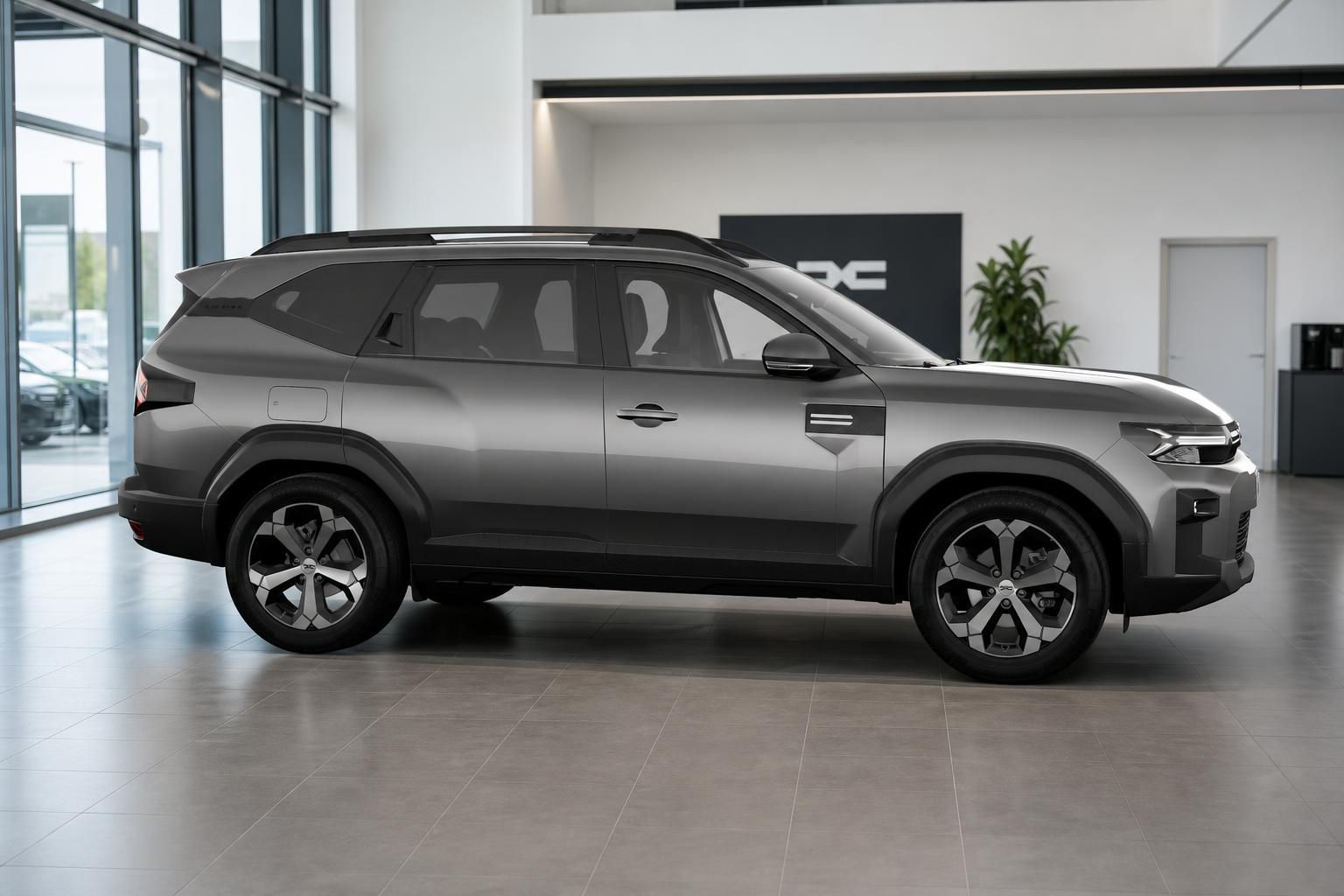 Dacia Bigster SUV grau Seitenansicht im modernen Autohaus