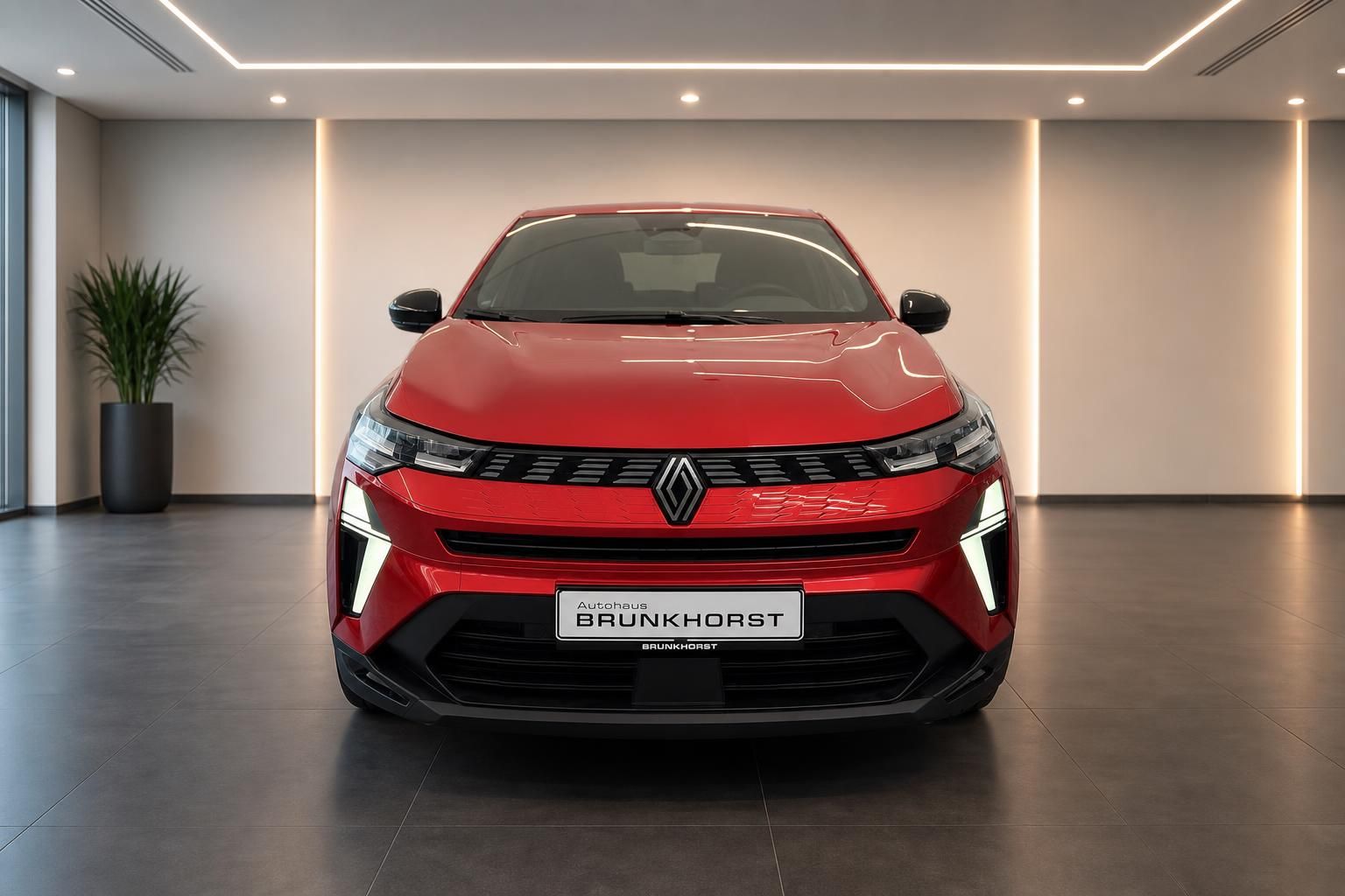Roter Renault Symbioz Frontansicht mit Kennzeichen Autohaus Brunkhorst in hellem Showroom