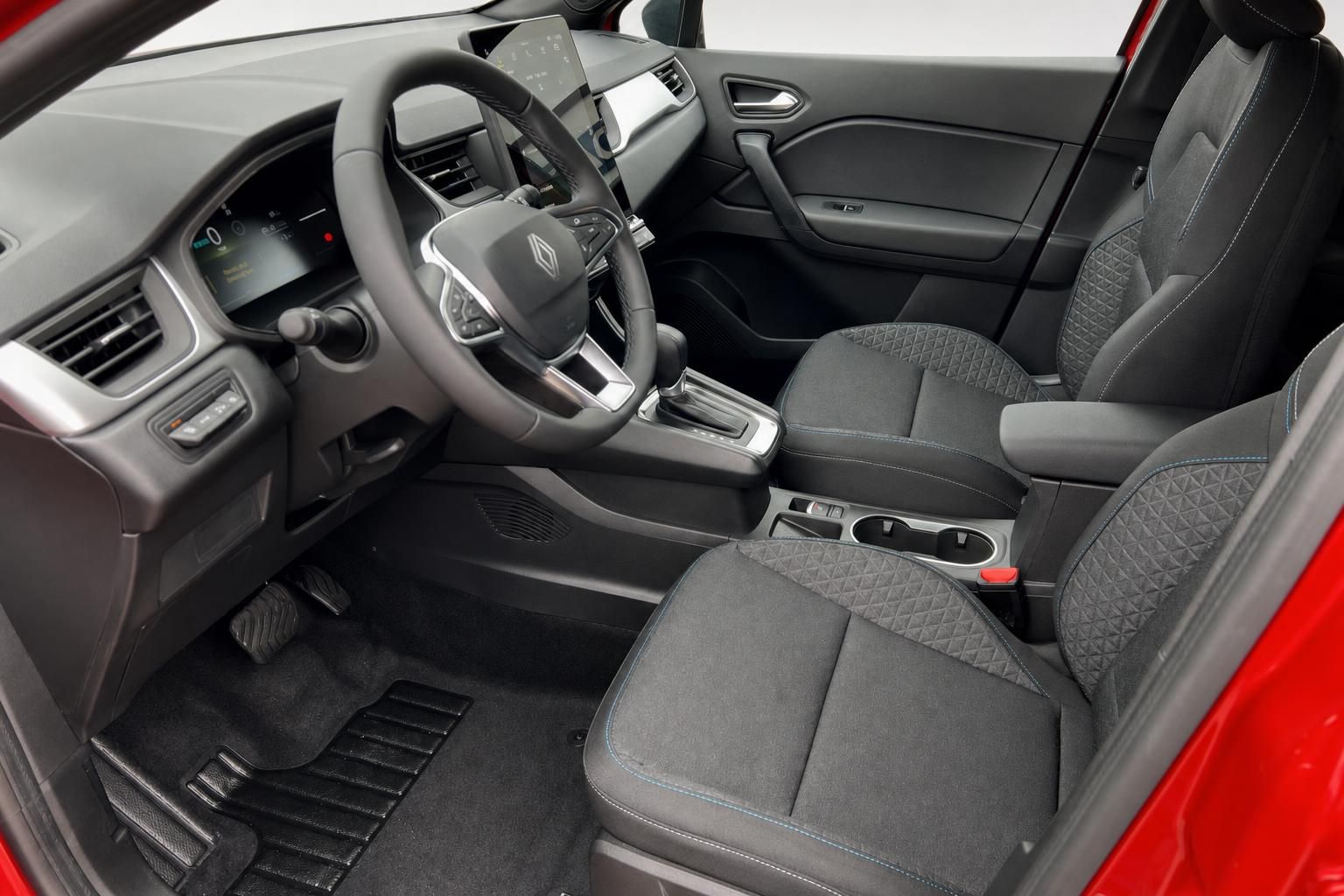 Renault Symbioz Innenraum mit grauem Stoff, Lenkrad und modernem Cockpit Design