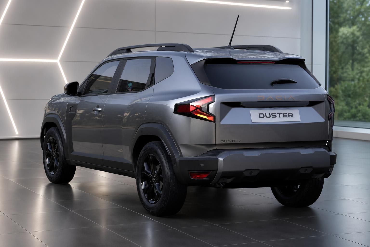 Dacia Duster SUV grau - Seitliche Heckansicht im Showroom mit LED-Rücklichtern