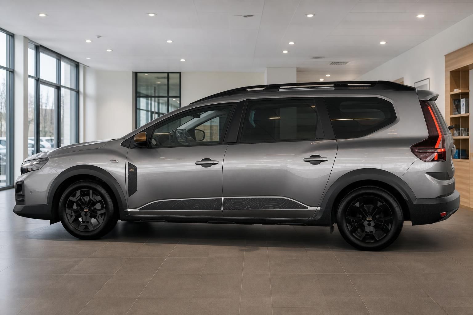 Dacia Jogger grau Seitenansicht komplett im Showroom