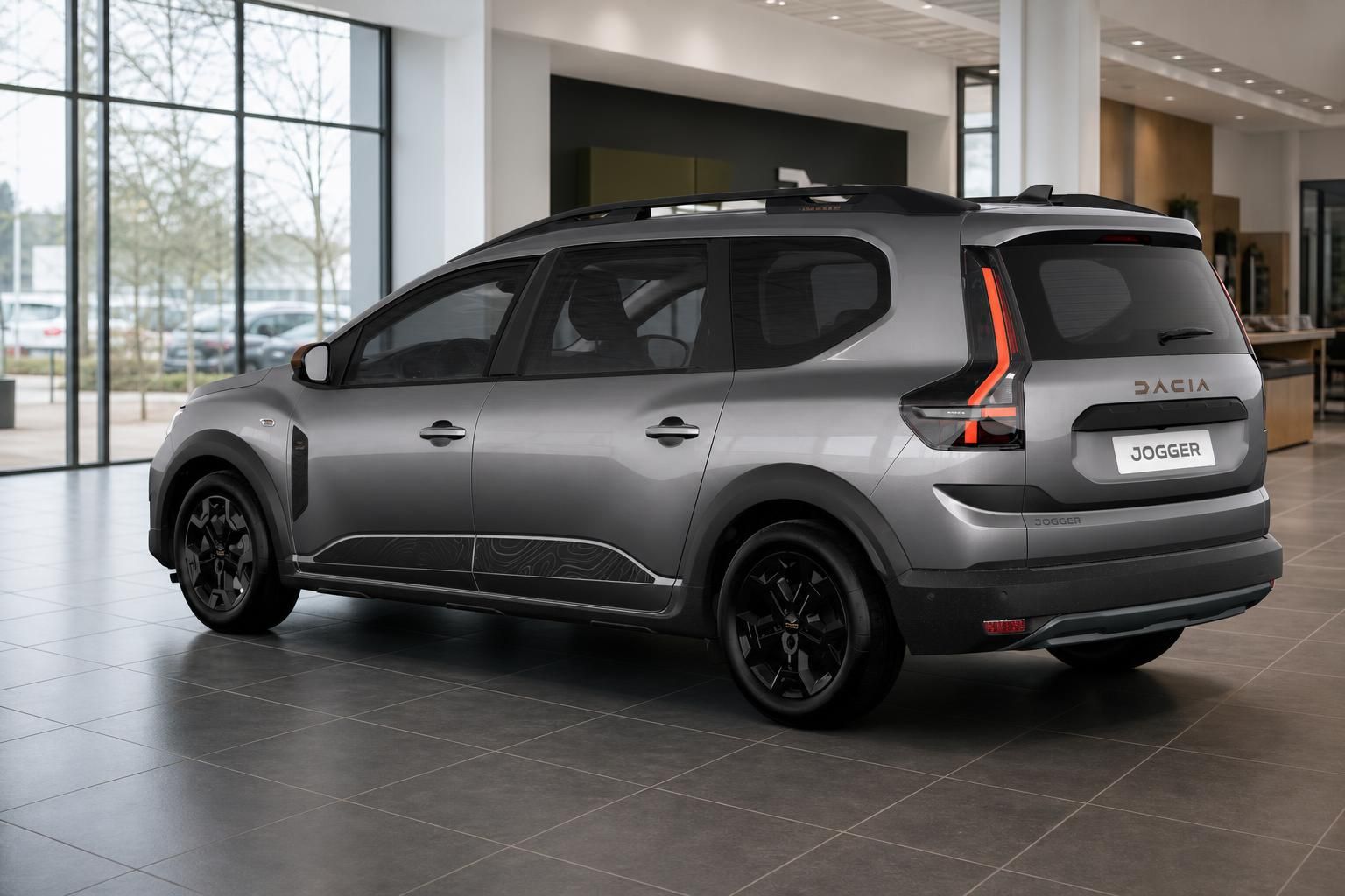 Dacia Jogger grau Seitenansicht Heck im Showroom