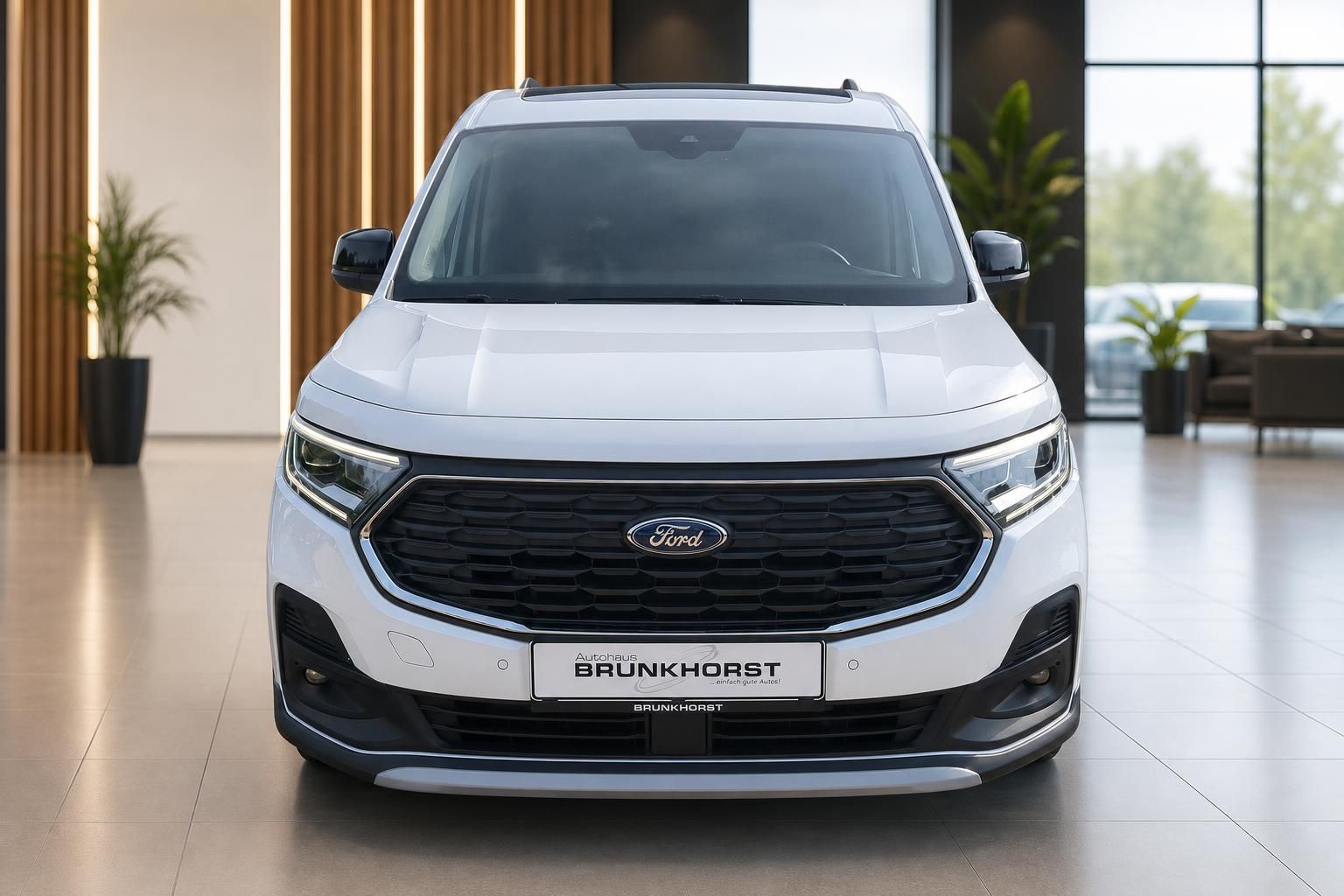 Weißer Ford Tourneo Frontansicht mit LED-Scheinwerfern und BRUNKHORST Kennzeichen