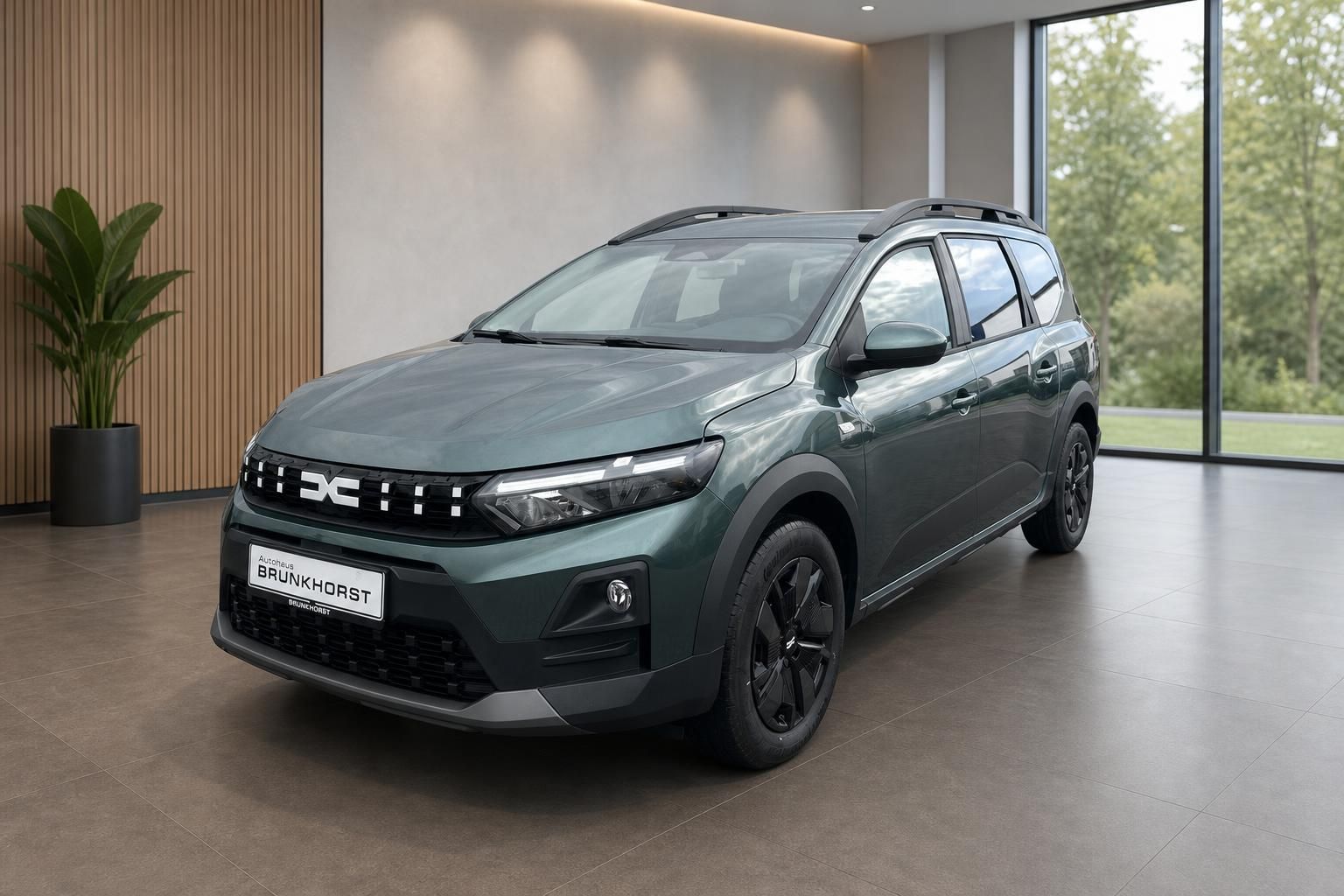 Dacia Jogger SUV Seitenansicht grau mit schwarzen Felgen im Autohaus