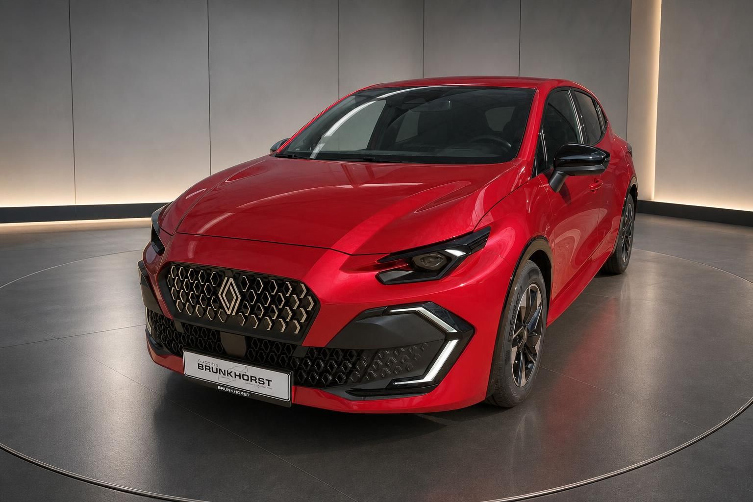 Renault Clio in Rot, Frontansicht schraeg im Autohaus Brunkhorst