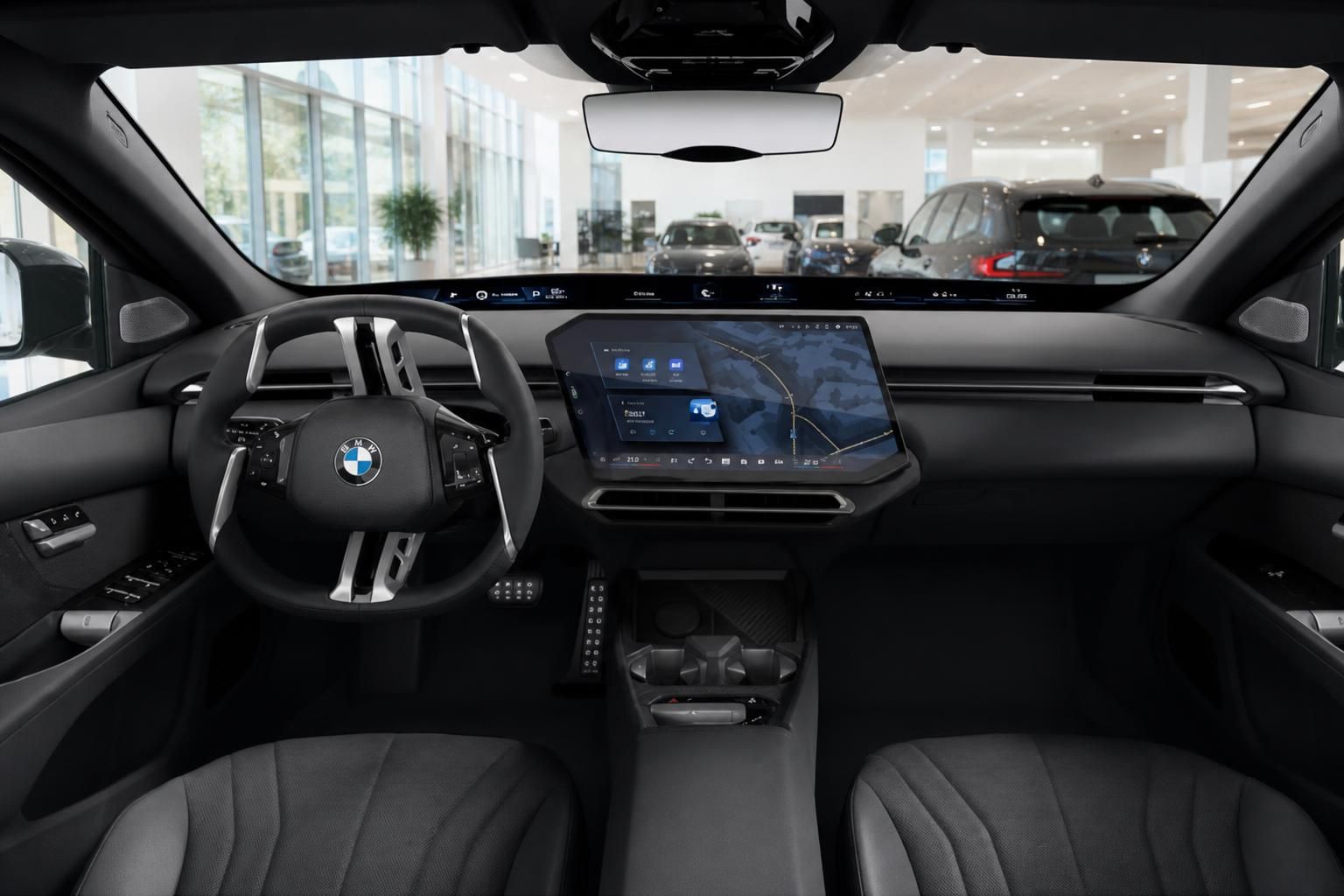 BMW Cockpit mit digitalem Curved Display und Lenkrad im Showroom