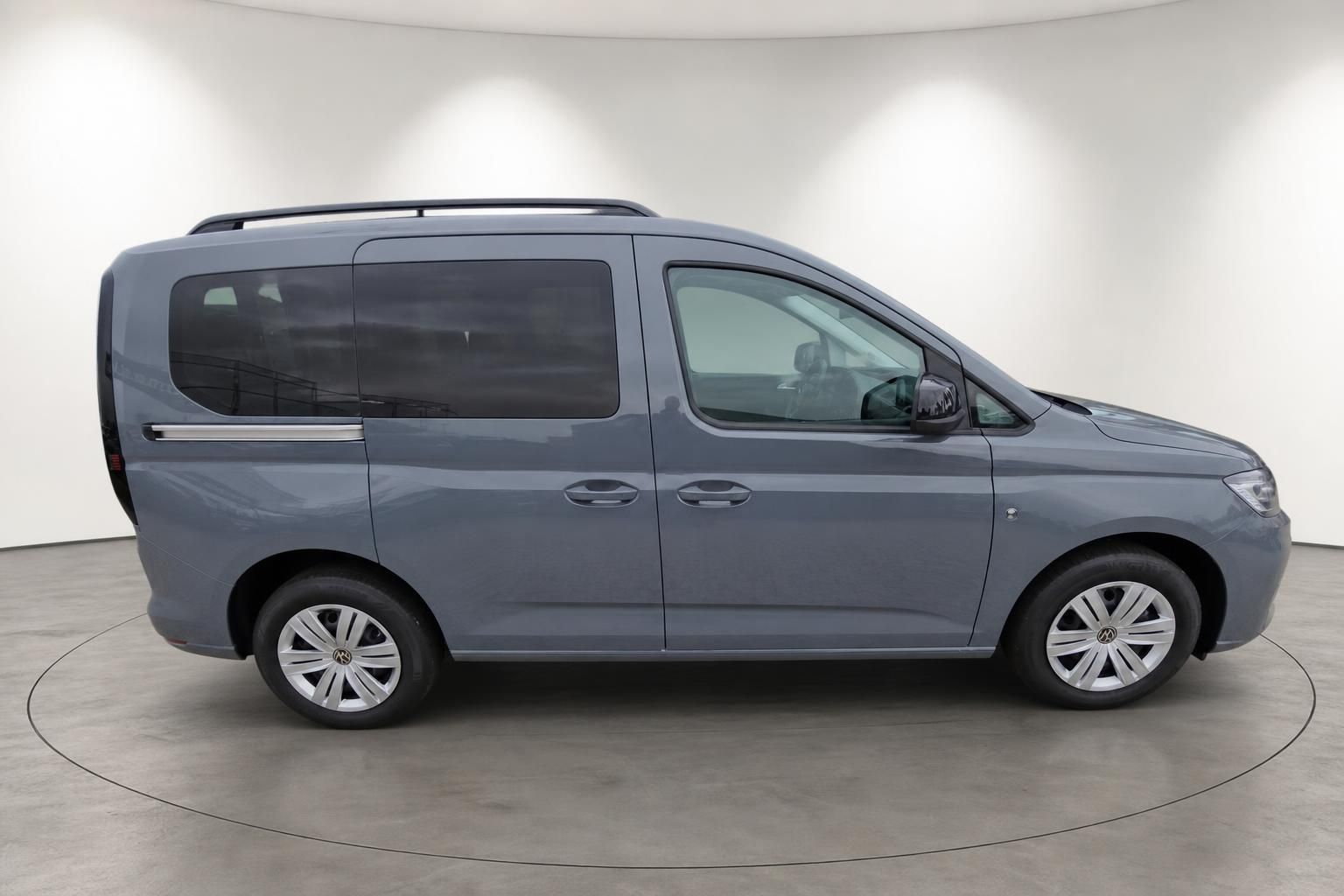 VW Caddy in Blaugrau Seitenansicht mit Alufelgen