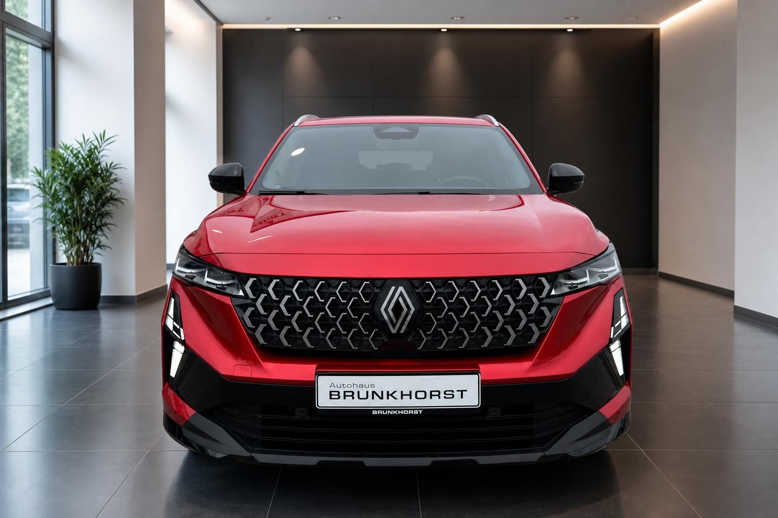 Renault Austral rot Frontansicht mit charakteristischem Kühlergrill und LED-Scheinwerfern