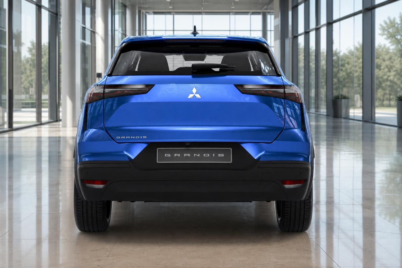 Mitsubishi Grandis blau Heckansicht in moderner Fahrzeughalle