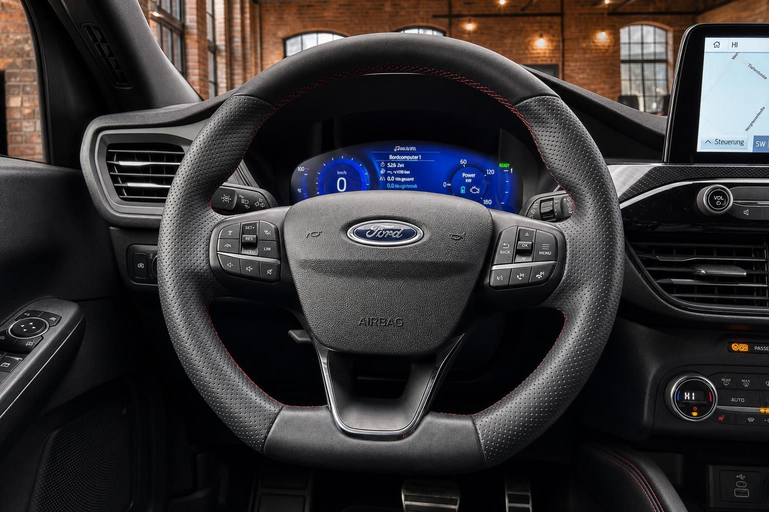 Ford Lenkrad Nahaufnahme mit digitalem Tacho und Ford Logo