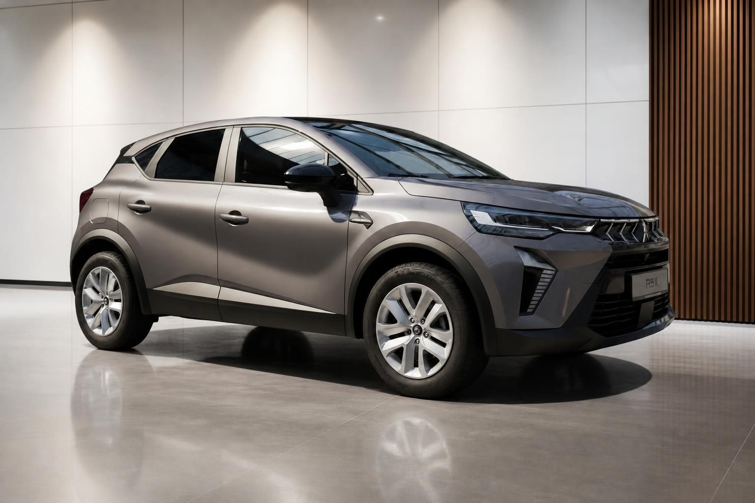 Mitsubishi ASX graubraun Frontansicht schräg rechts im Showroom