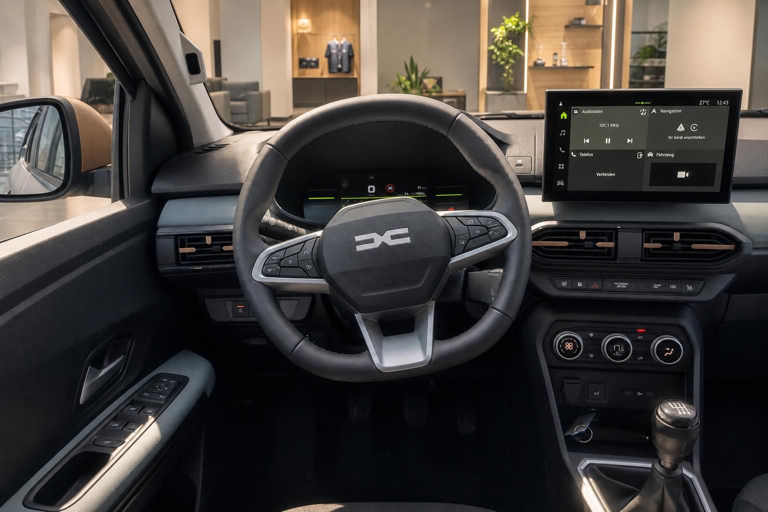 Cockpit mit Lenkrad und Infotainment-Display im Fahrzeuginnenraum