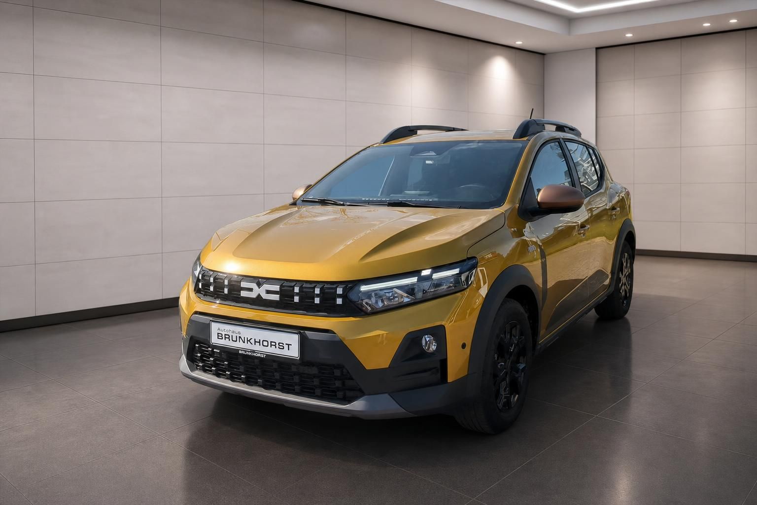 Dacia Sandero Stepway gelb Schrägansicht vorne links im Autohaus Brunkhorst