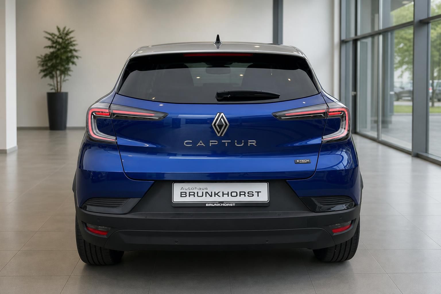 Renault Captur E-Tech blau Heckansicht mit LED-Rücklichtern im Autohaus Brunkhorst