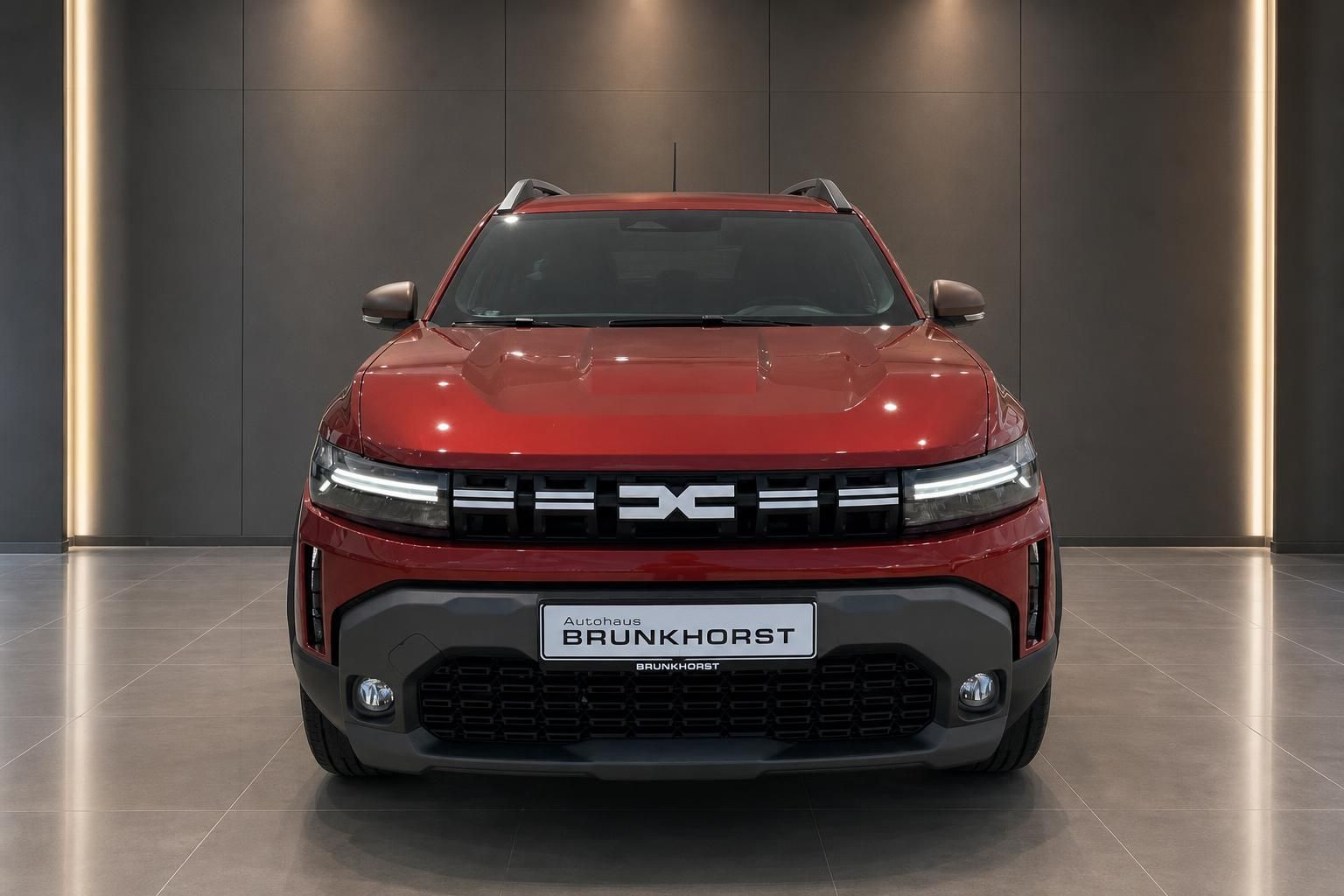 Dacia SUV Frontansicht in Rot - Autohaus Brunkhorst