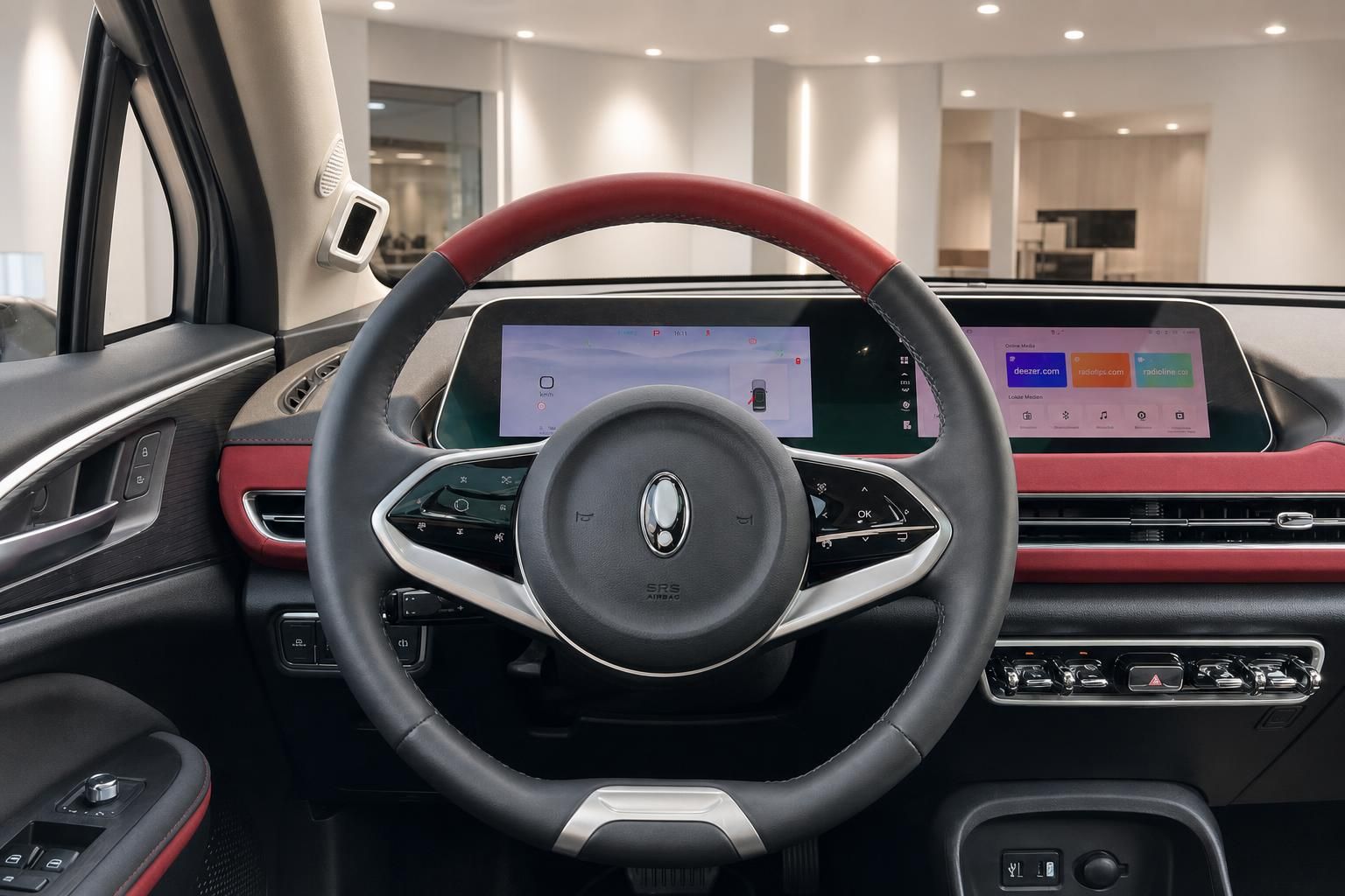 Cockpit mit Lenkrad und Digitaldisplay im Fahrzeuginnenraum, rote Ledersitze
