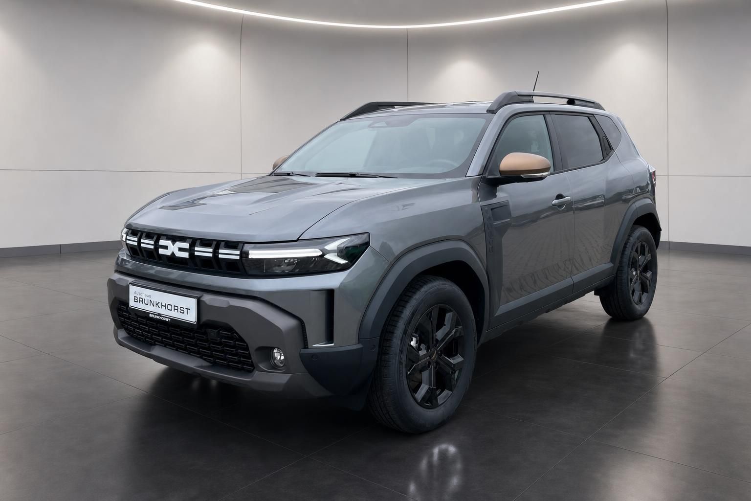 Dacia Duster grauer SUV Dreiviertelansicht seitlich mit schwarzen Felgen