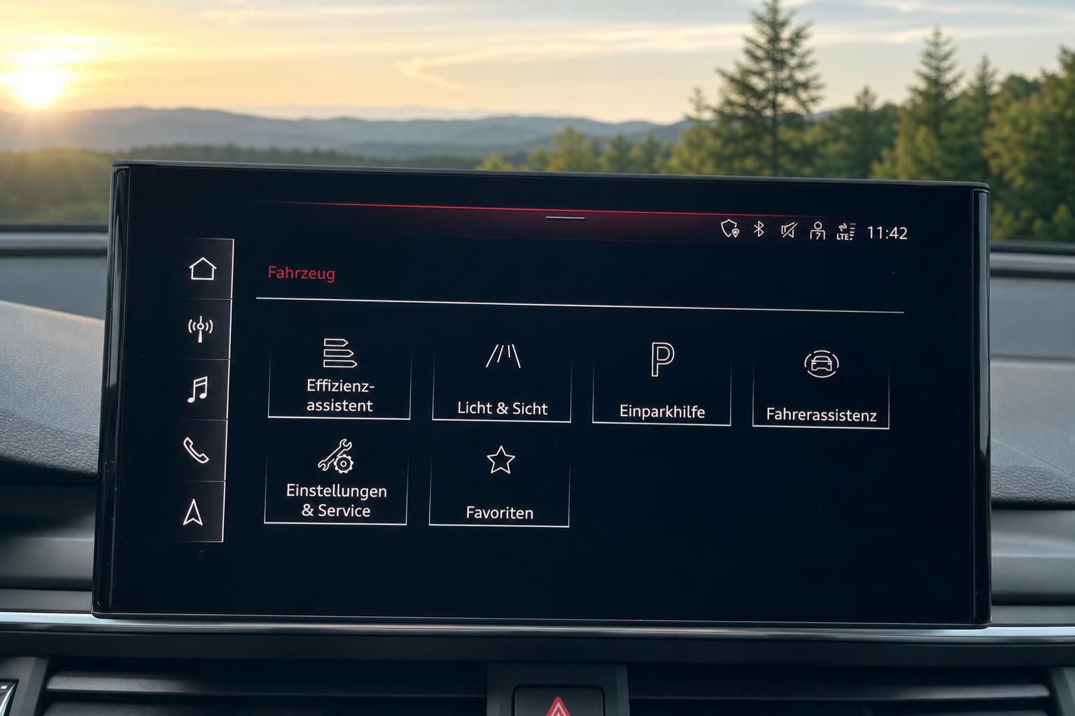 Audi Infotainment-Display mit Fahrzeugmenue und Naturblick durch Frontscheibe