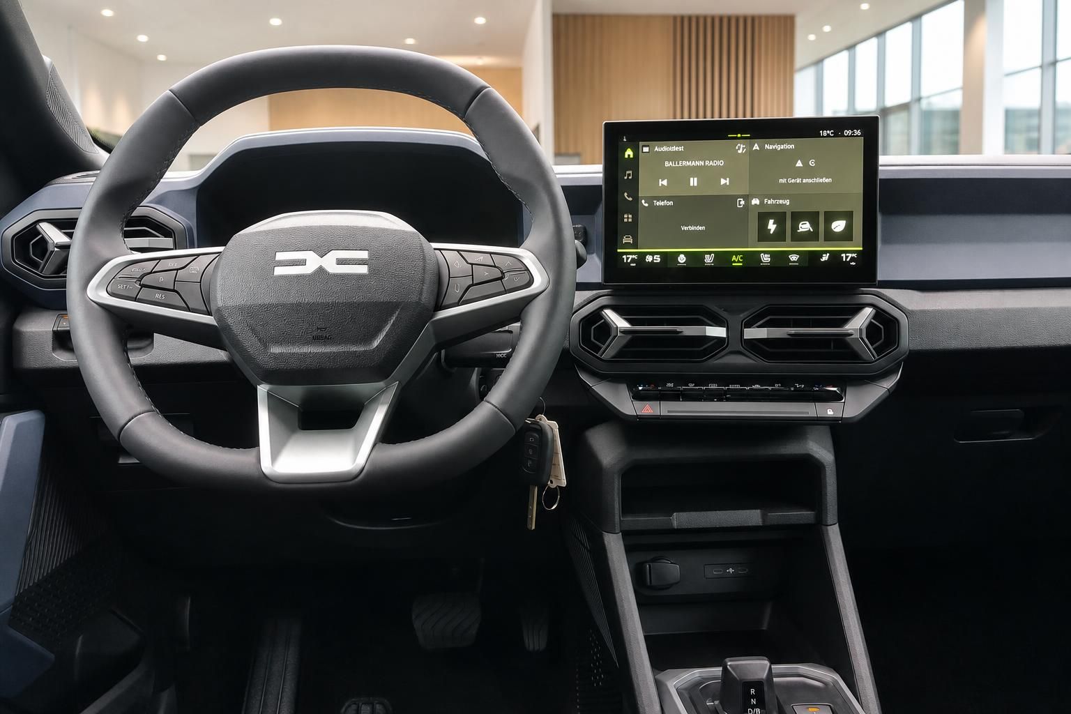 Dacia Innenraum mit Lenkrad, Touchscreen-Infotainment und Mittelkonsole im Cockpit