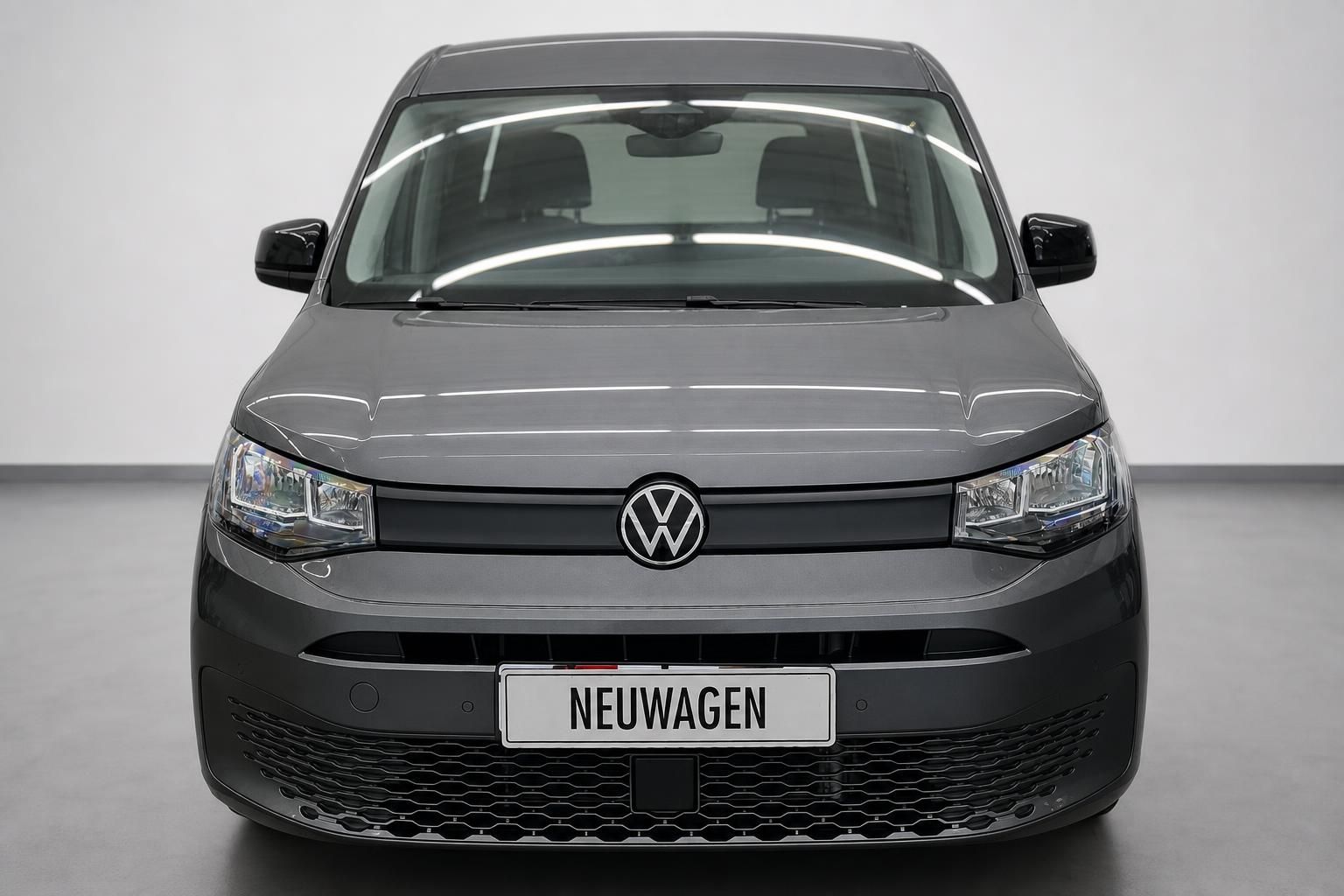 VW Caddy grau, Frontansicht frontal im Studio