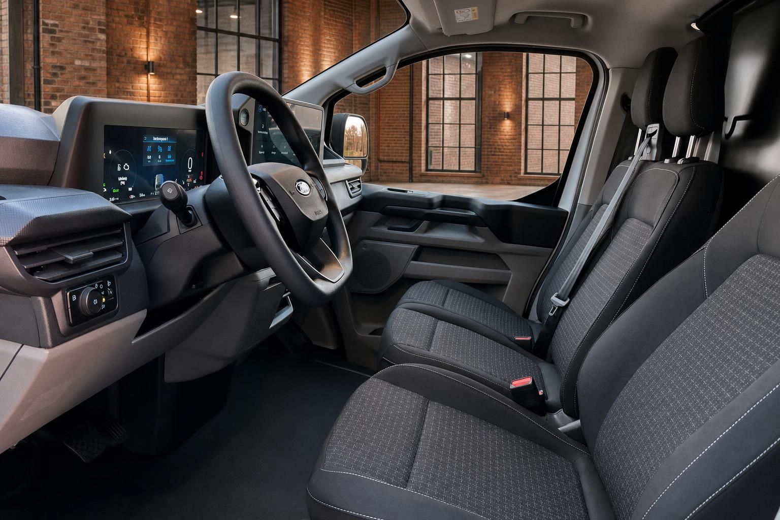 Ford Transit Innenraum Fahrerseite mit Lenkrad, Cockpit und Stoffsitzen in Grau