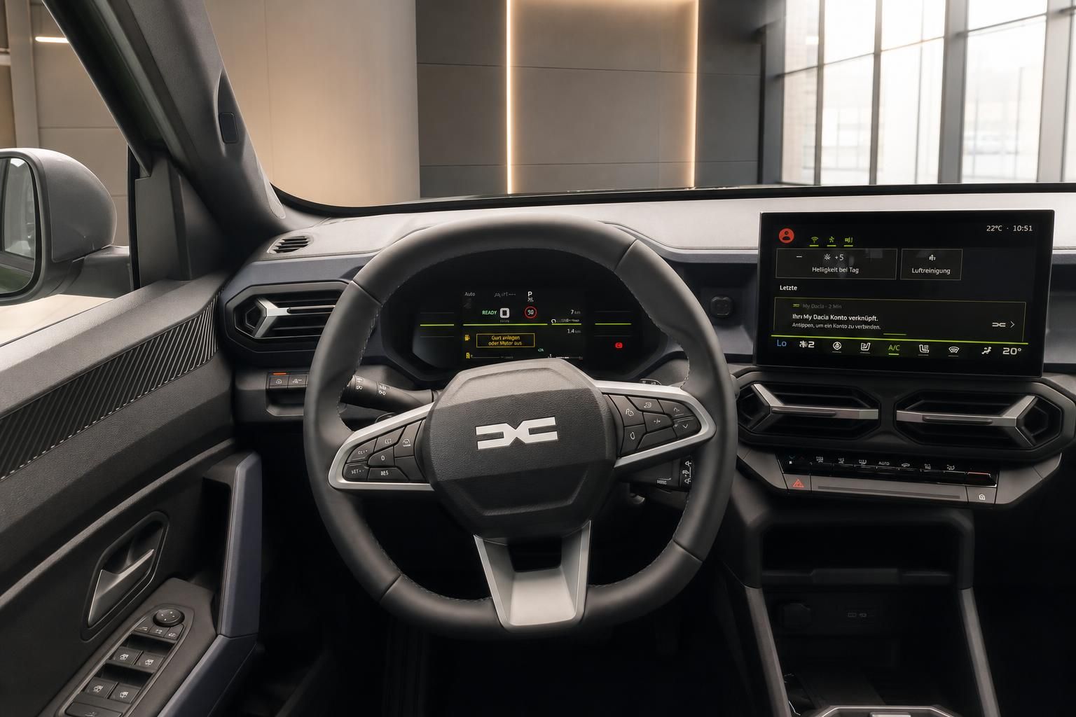 Dacia Cockpit mit Lenkrad, digitalem Kombiinstrument und Touchscreen-Infotainmentsystem