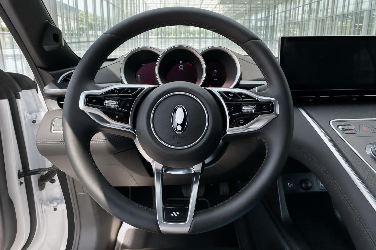 GWM ORA 07 Innenraum – Lenkrad mit Multifunktionstasten, Kombiinstrument und Infotainment-Display