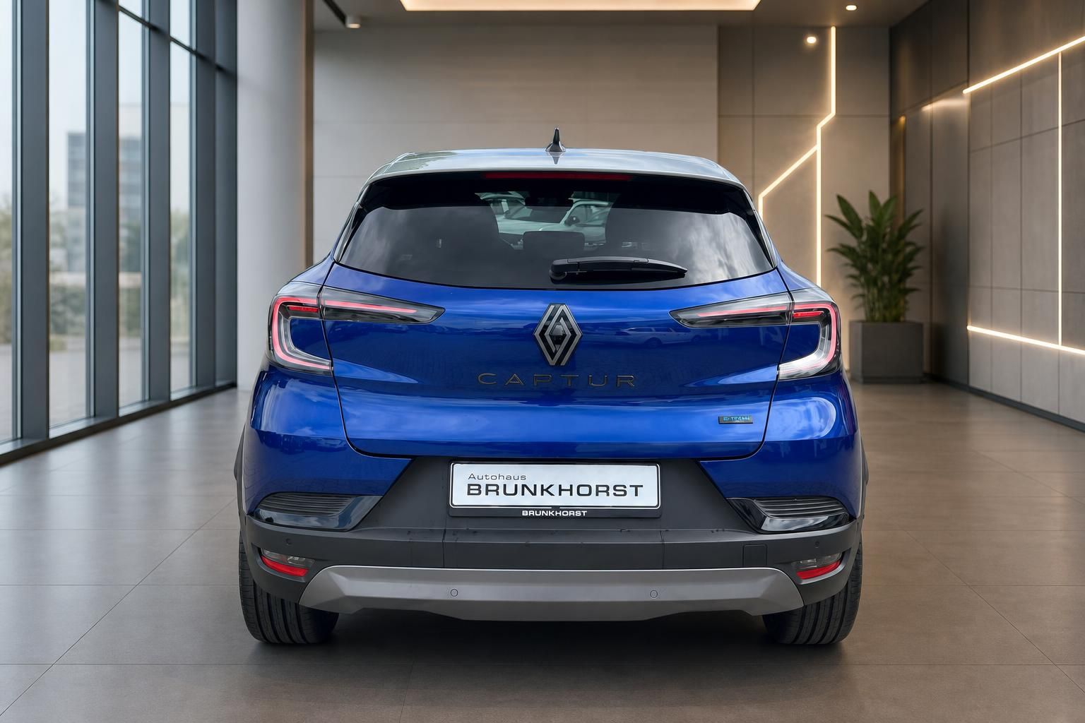Renault Captur Heckansicht in Blau mit LED-Rückleuchten und Autohaus Brunkhorst Kennzeichen
