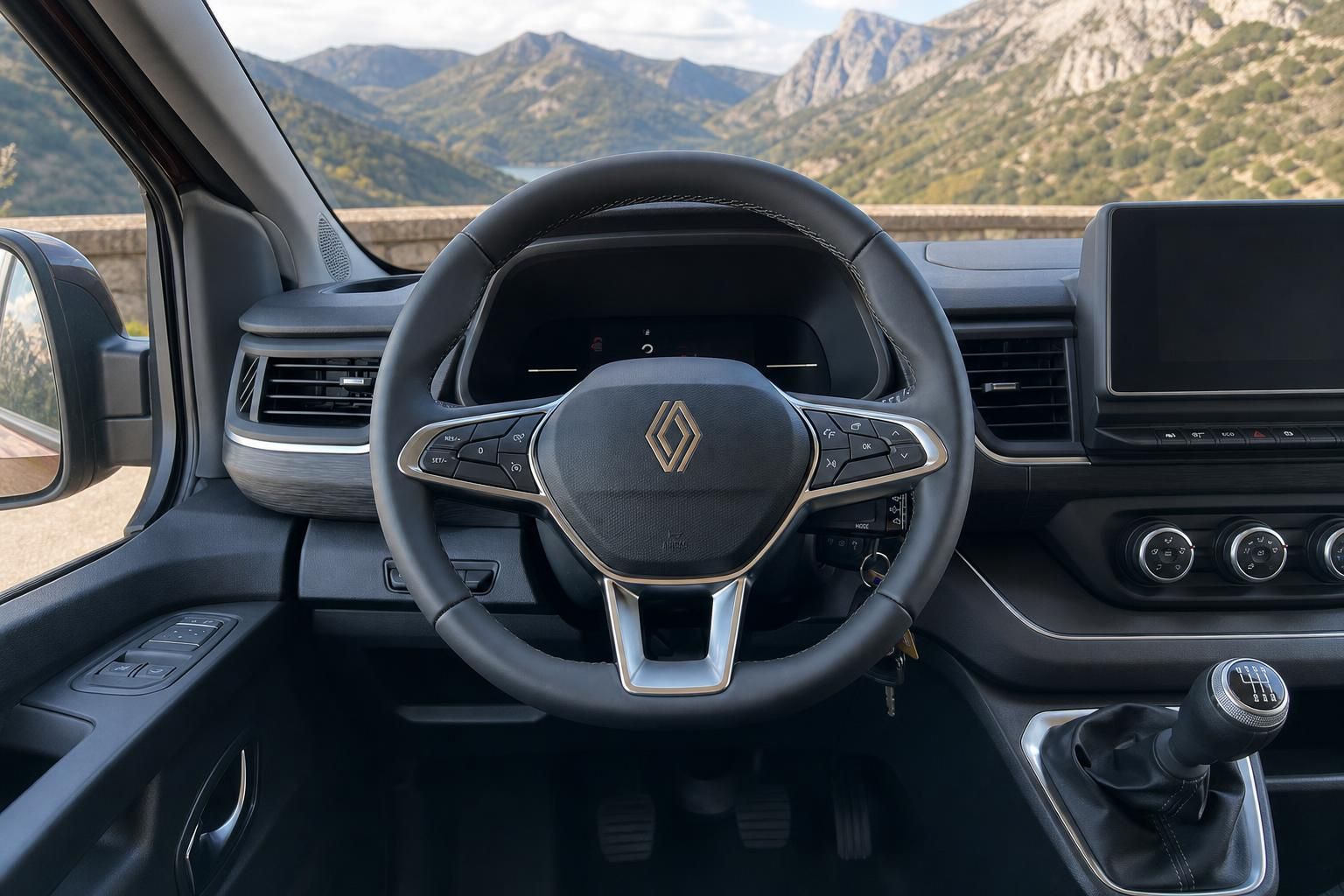 Renault Fahrzeug Cockpit mit Lenkrad und Armaturenbrett vor Berglandschaft