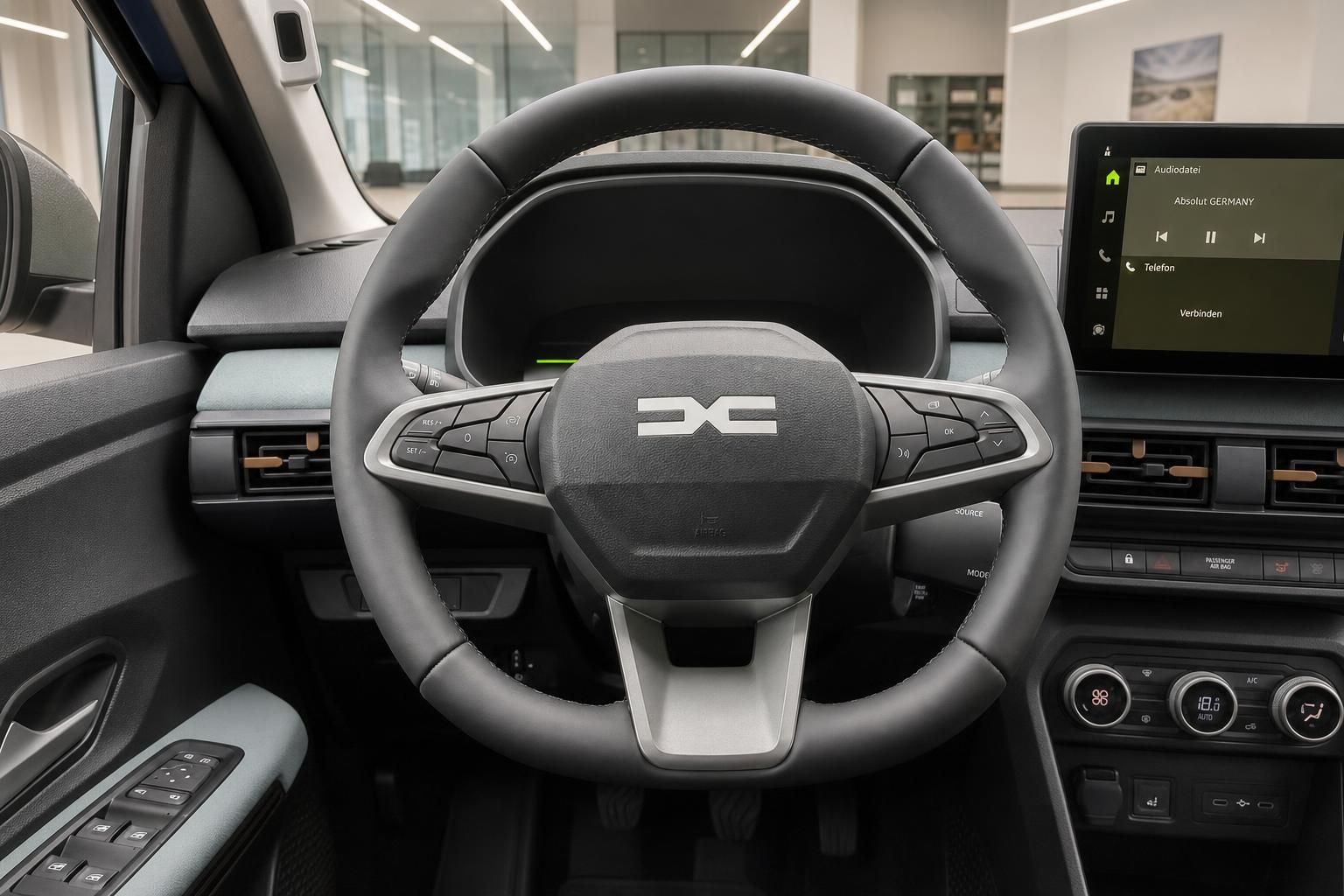 Dacia Lenkrad mit Multifunktionstasten und Infotainment-Display im Innenraum