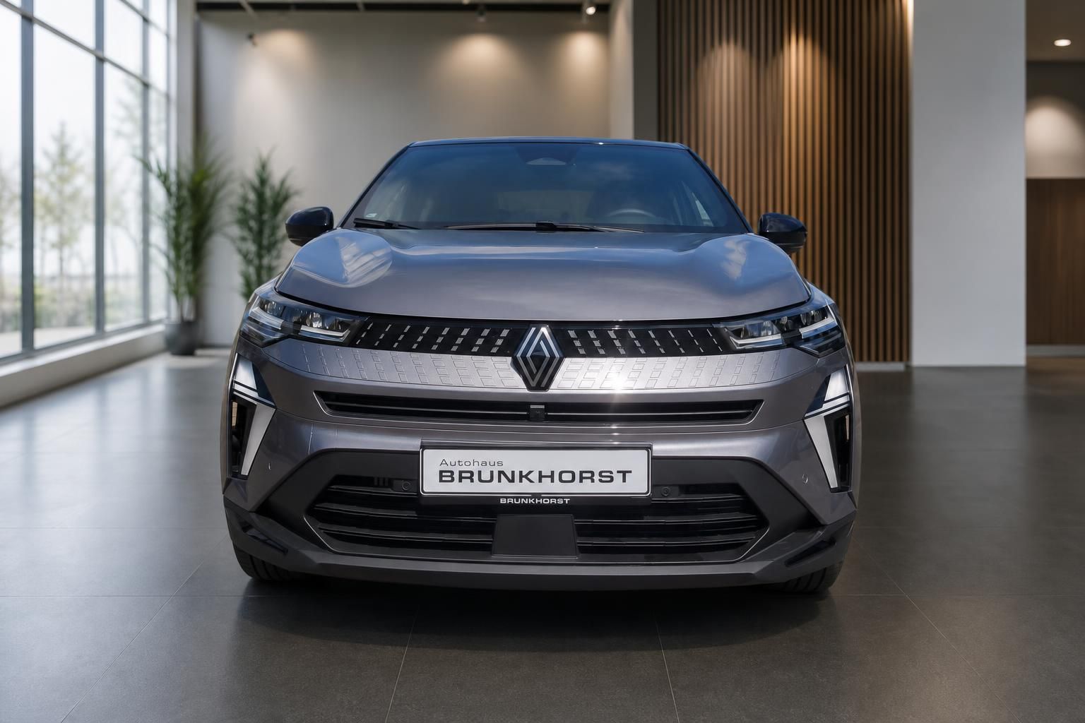 Renault Captur Frontansicht in grau mit markanter LED-Beleuchtung und Kühlergrill