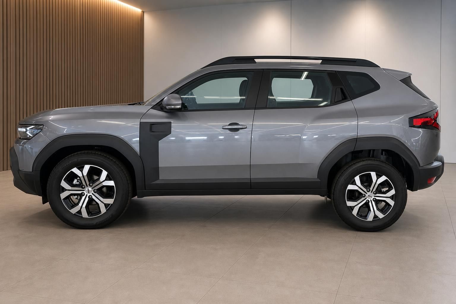 Dacia Duster SUV grau Seitenansicht links mit Leichtmetallfelgen und schwarzem Dach