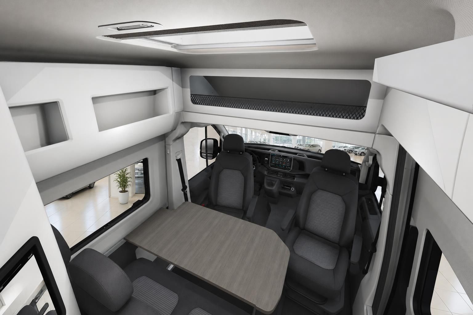 Wohnmobil Innenausbau mit Fahrersitzen Tisch und Dachfenster