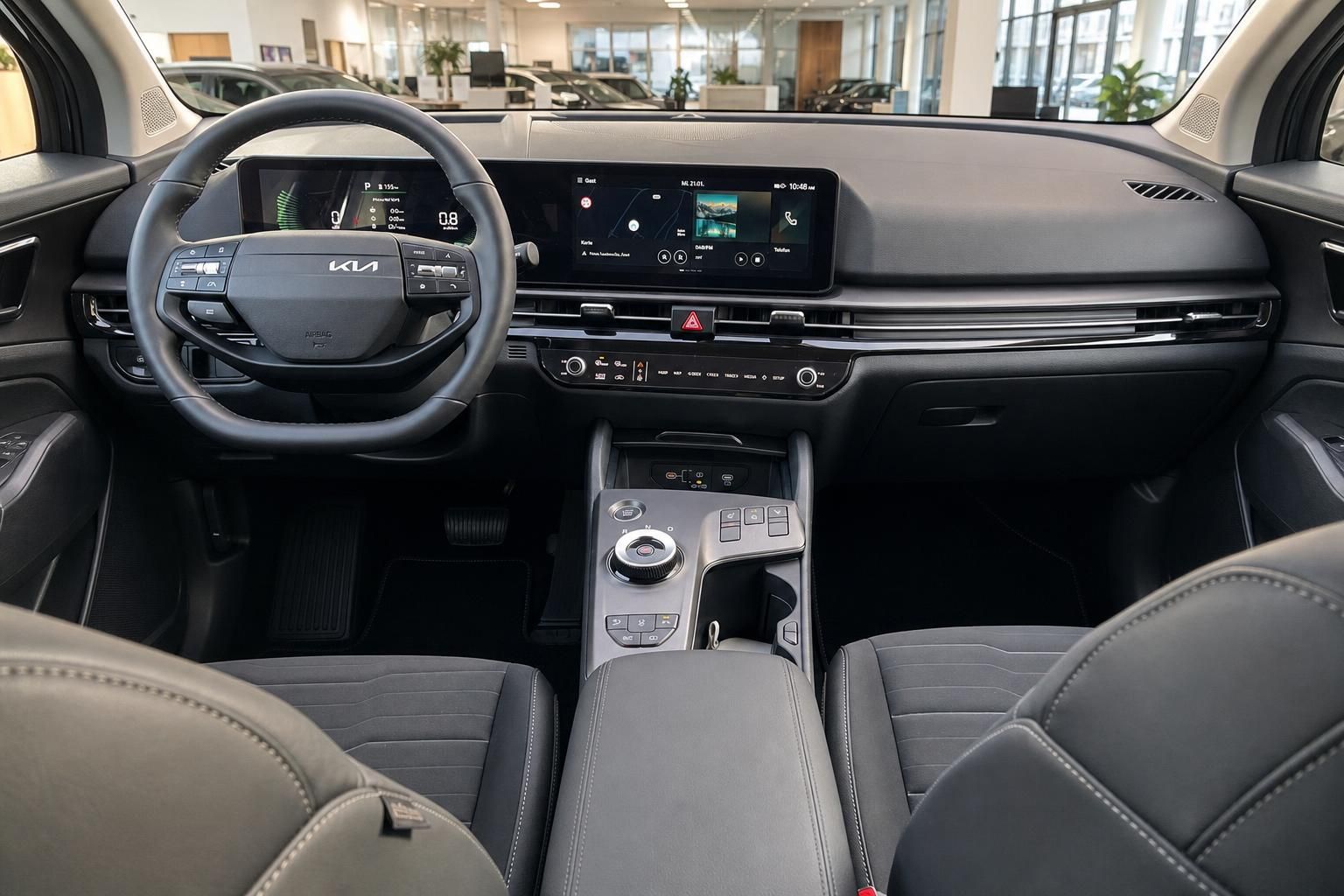 Kia Sportage Cockpit mit Lenkrad und Bildschirmen von vorne