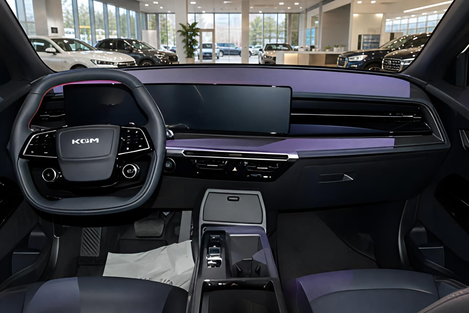 KGM SUV Innenraum mit modernem Cockpit, Lenkrad und großem Touchscreen-Display