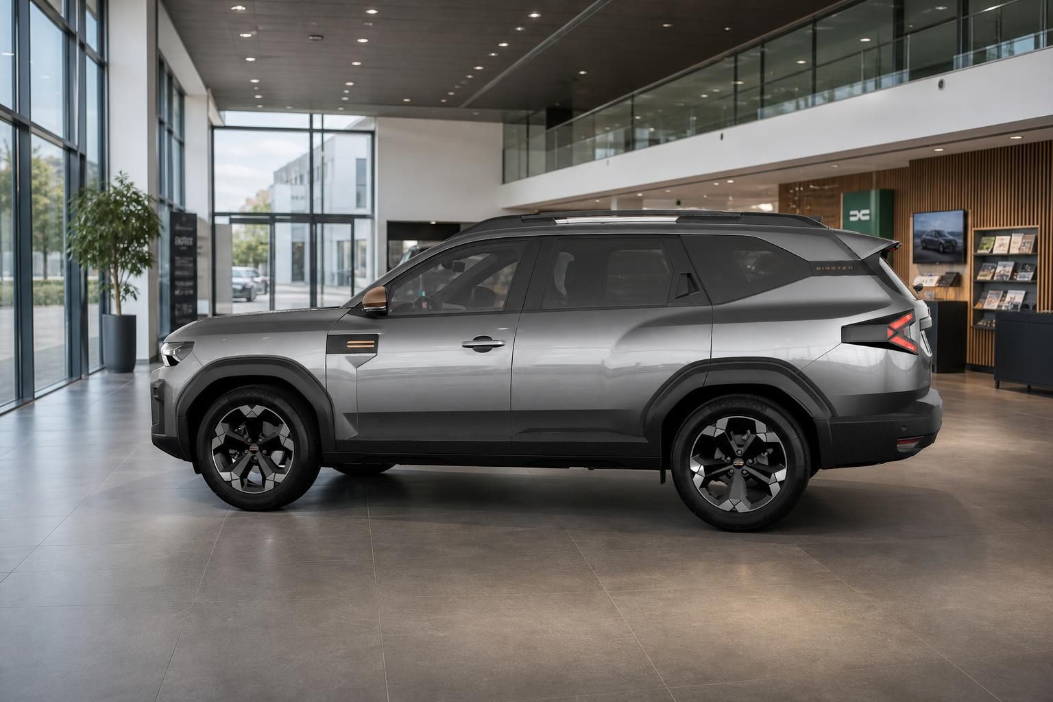 Dacia Bigster SUV in Grau, Seitenansicht im Autohaus