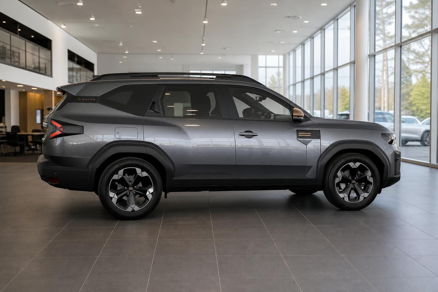Dacia Bigster in Grau Seitenansicht im Autohaus Showroom