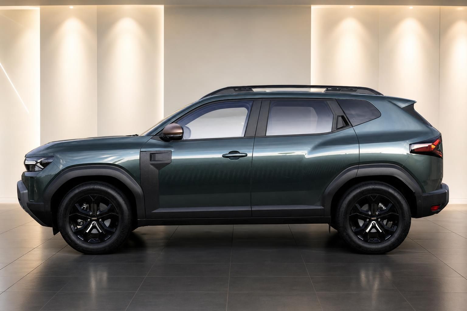 Dacia Duster grün metallic - Seitenansicht des kompakten SUV mit schwarzen Leichtmetallrädern