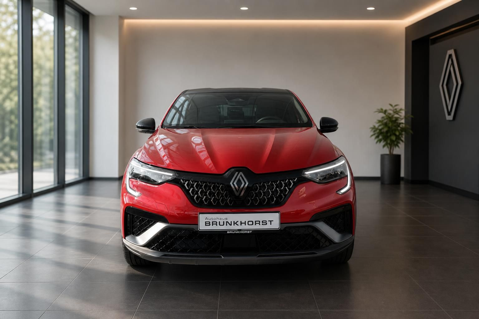 Roter Renault Arkana Frontansicht im Autohaus Brunkhorst Showroom