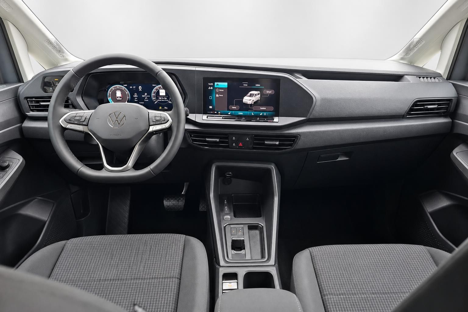 VW Caddy Innenraum Cockpit mit Lenkrad und Infotainment-Display