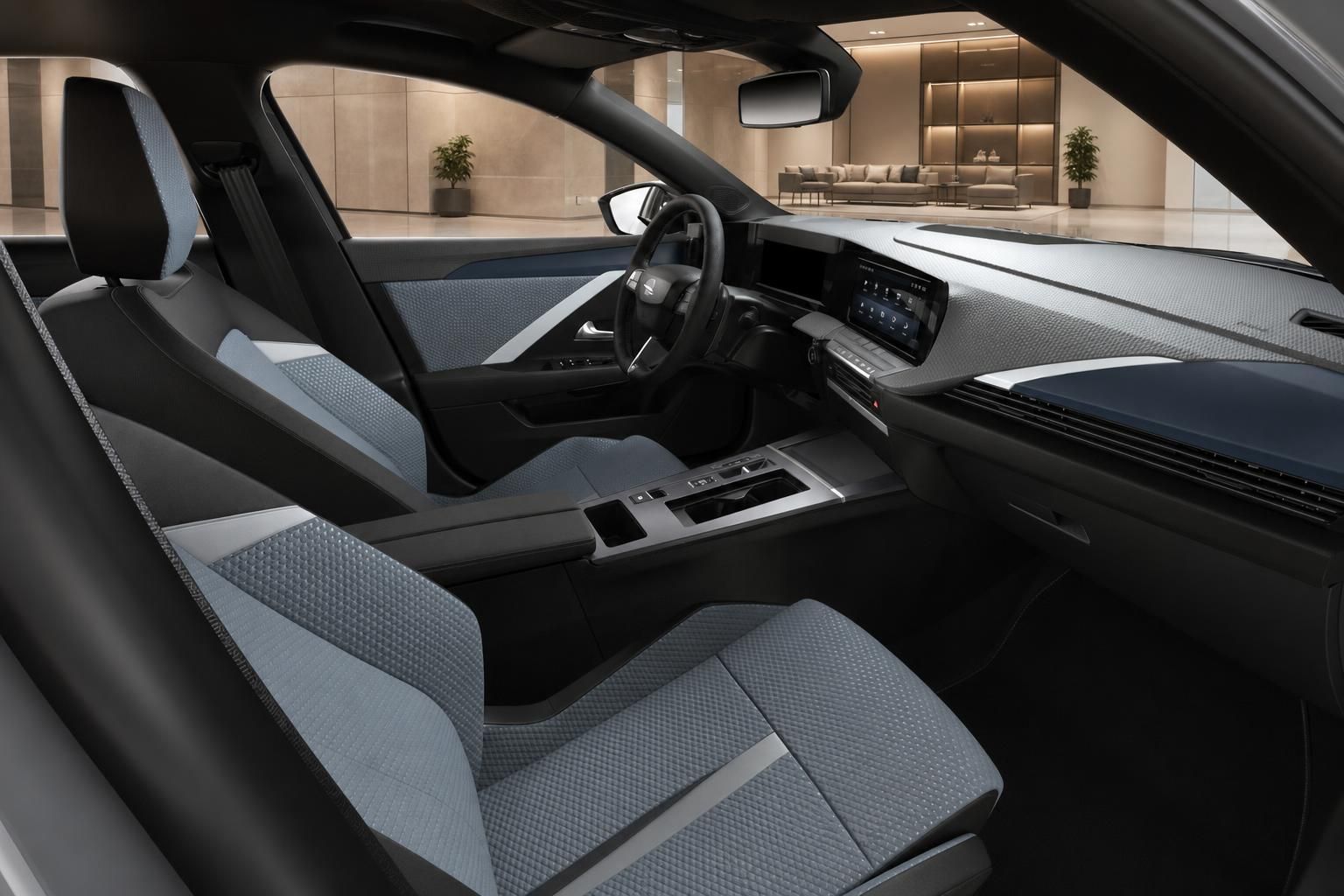 Opel Astra Innenraum mit blau-schwarzer Sitzpolsterung und Cockpit