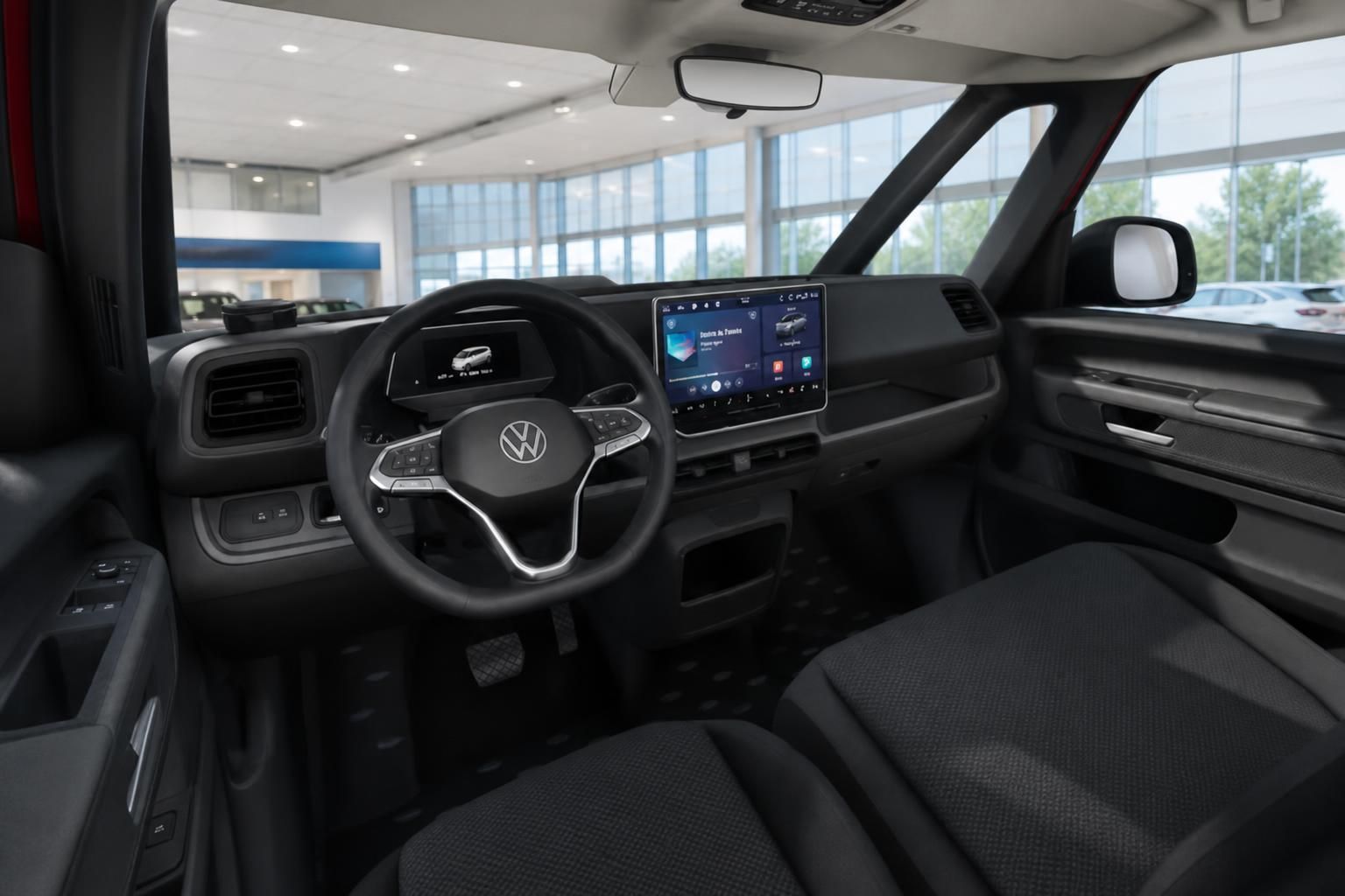 VW Transporter Innenraum – Cockpit mit Lenkrad, Touchscreen-Infotainment und Fahrersitz